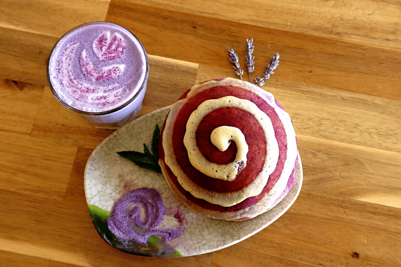 Purple cream spiral pastry with a matching drink